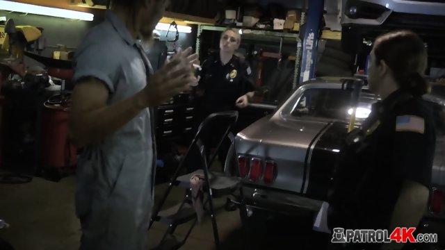 These busty cops are out of control, they enter this car shop without any permission just to use him