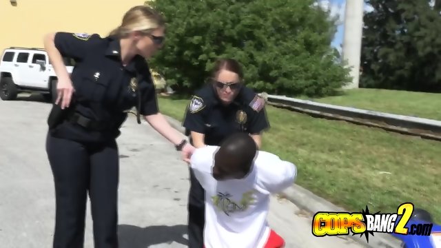 Black criminal is getting assaulted and fucked by horny busty white cops.