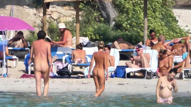 Happy naked sunbathers in Spain
