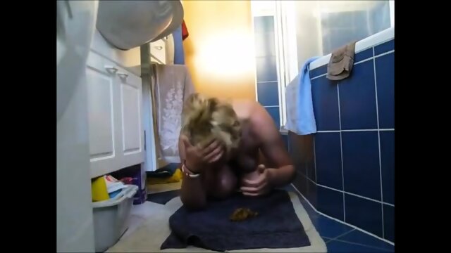 Blonde shitting on the floor and smearing on tits and face