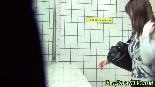 Japanese lady peeing in restroom