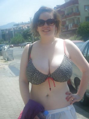 Huge pale boobies stuffed into a polka dot bikini