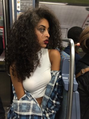 amateur photo Curly hair girl in metro