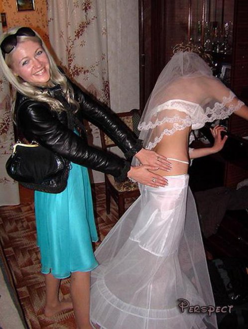 Embarrassed bride dealing with an unexpected wardrobe malfunction