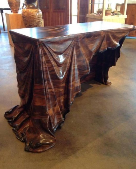 Wooden table with wooden cloth carving