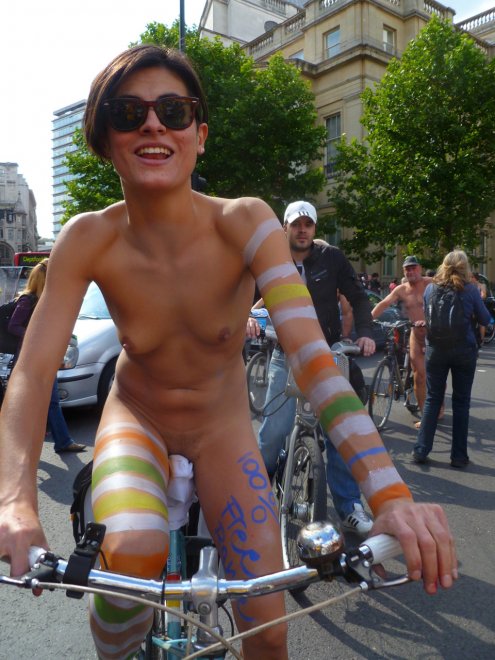 flat-chested short hair naked cyclist on the street