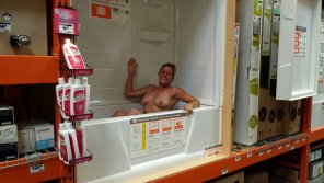 amateur photo Naked in a retail store bathtub display