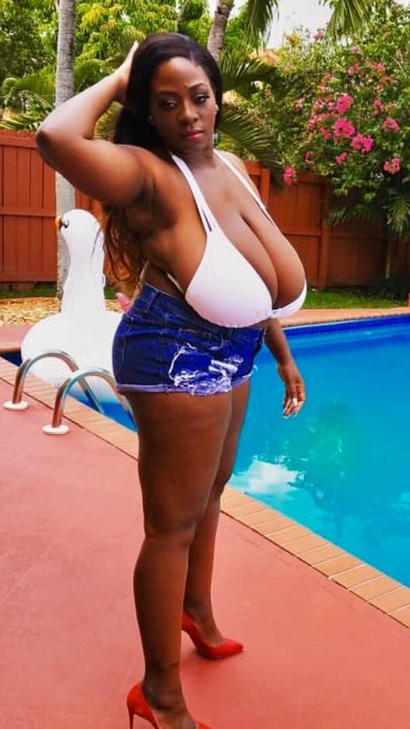 Huge beautiful boobs packed into white bikini