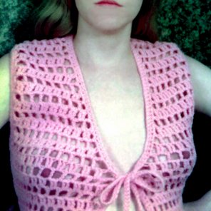 amateur photo MILF braless in an open weave top