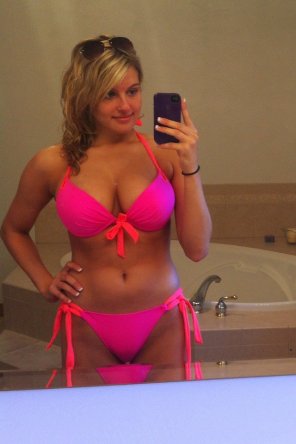 Outstanding tits in a pink bikini.