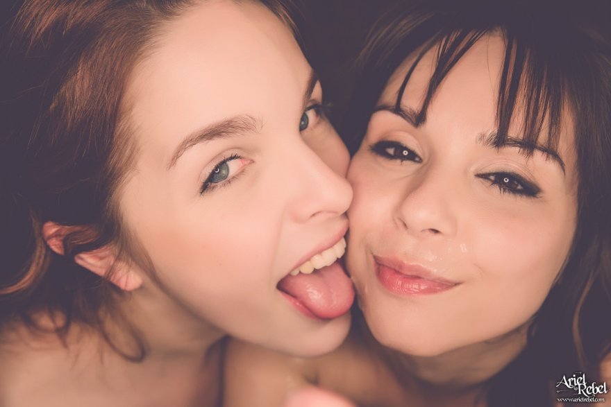 Licking the cum off of her friend