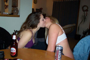 amateur photo Appears to be an alcohol fueled game of truth or dare.