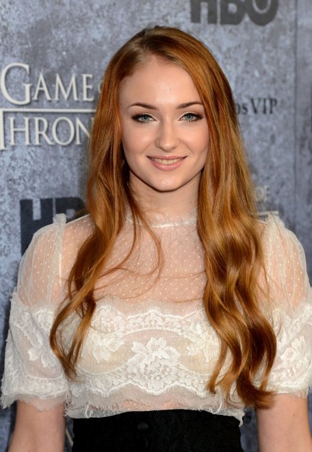 Sophie Turner in a mostly sheer white top