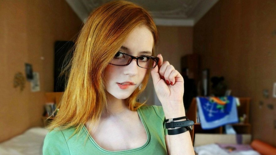 Beautiful ginger in glasses