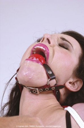amateur photo Tighten the gag to make her drool more