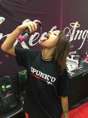 foto amateur holly Hendrix having some fun with our sponsor Spunked Lube at our Exxxotica booth in Columbus OH