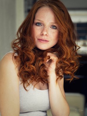 Classic redhead combo: blue eyes, red hair.
