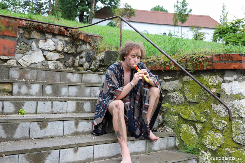 Naughty granny Lavra Red takes a homeless boy home for some wild sex