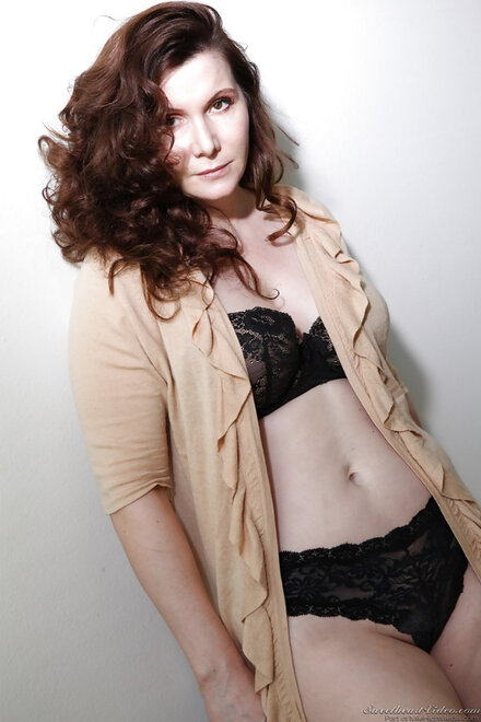 Older lady Nica Noelle removes black bra and panties to model in nude