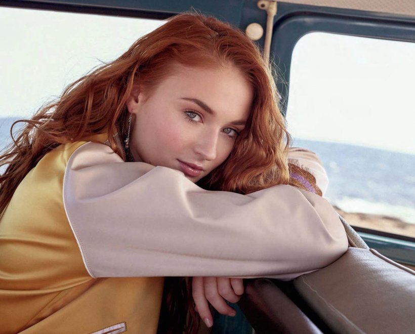 Sophie Turner in the backseat of a car