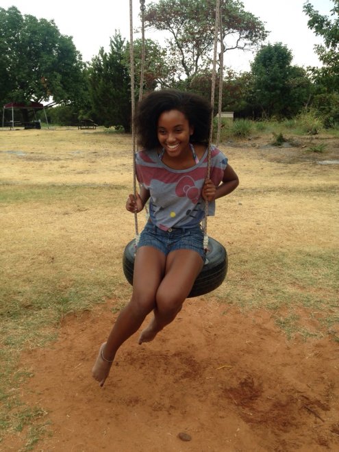 Beautiful ebony on a swing