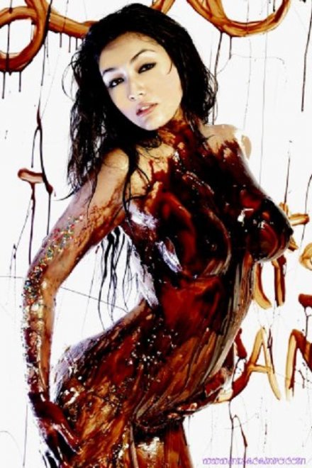 Misa Campo covered in chocolate syrup