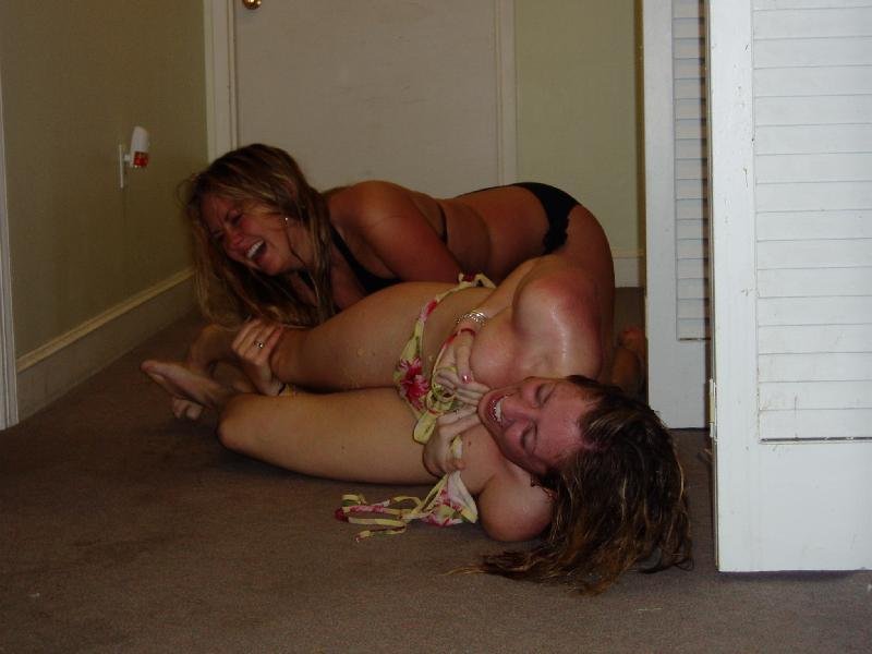 Girls laughing hysterically on the floor