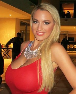 amateur photo Busty blonde looking classy in red