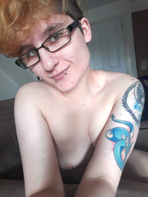 amateur photo Glasses, tattoos, and a sneaky piercing...