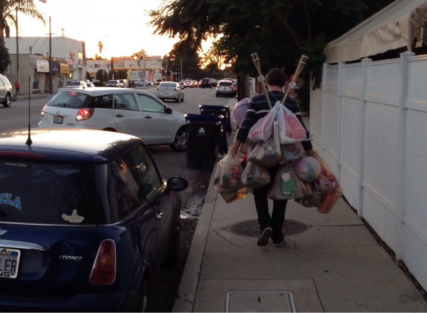 He's determined to take all those groceries in one trip...like really determined.