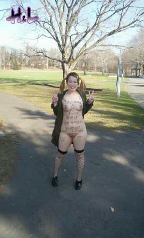 Japanese slut with body writing in the park.