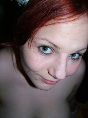 amateur photo Redhead with cum on her face