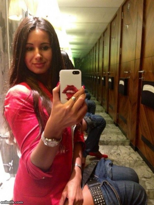 Super hot chick taking a selfie while on the toilet