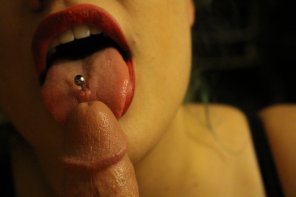 Red Lipstick and Tongue Piercing Licking Tip of Cock