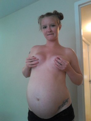 amateur photo Pinching her nipples