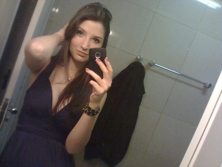 Mirror + black dress + little cleavage
