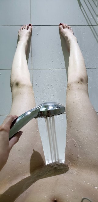 Stretching out my long, pale legs in the shower so I can cum a few times :D