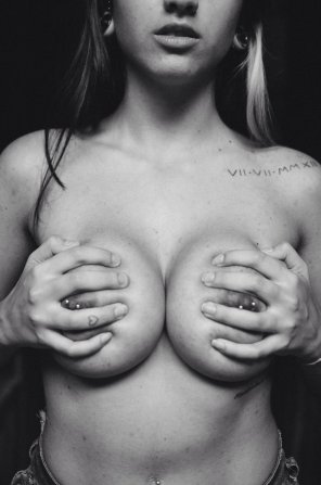 amateur photo Hand bra with pierced tits