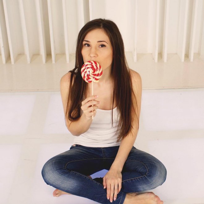 Licking a lollipop