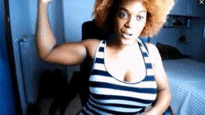 European Black Muscle Girl with Big Tits Flexes Biceps