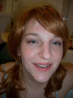 amateur photo Nice ginger with pigtails and a facial
