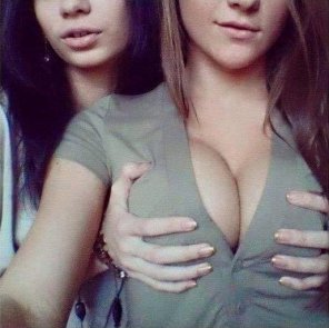 amateurfoto Cupping her breasts
