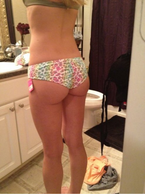 Trying on her new rainbow leopard print panties