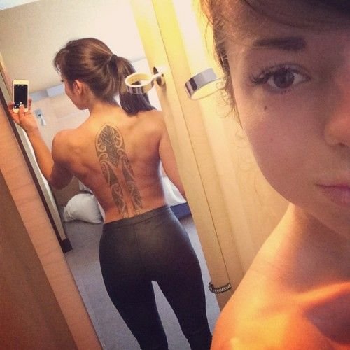 Tattoo on her back is just awesome.