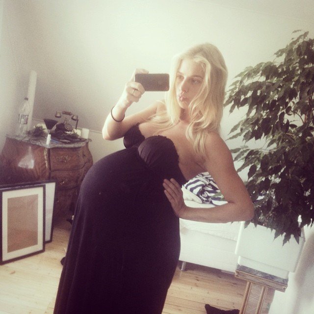 Huge blonde in a black dress