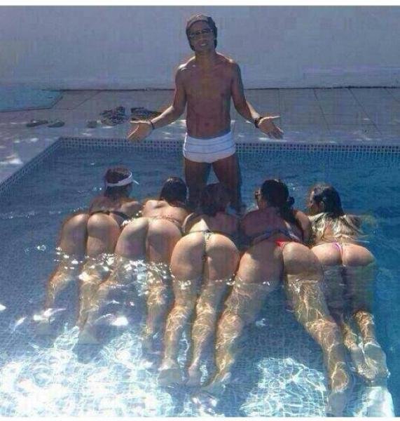 Brazilian soccer player Ronaldinho in his pool with 5 "guests"