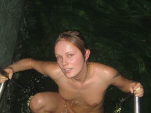 A cute amateur babe getting out of a pool