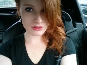 amateur photo Pink lips, red hair, and pale skin.