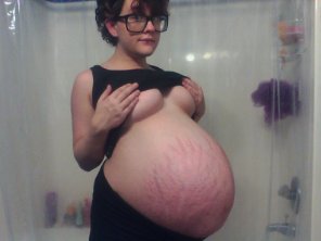 amateur photo Huge belly on a tiny girl