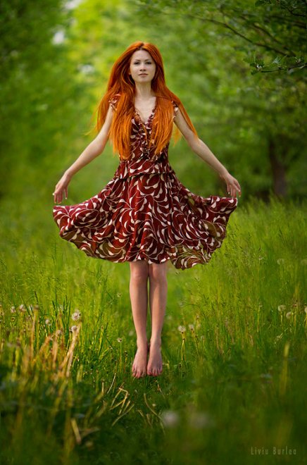 Beautiful redhead in the nature